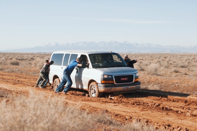 A van stuck in the mud