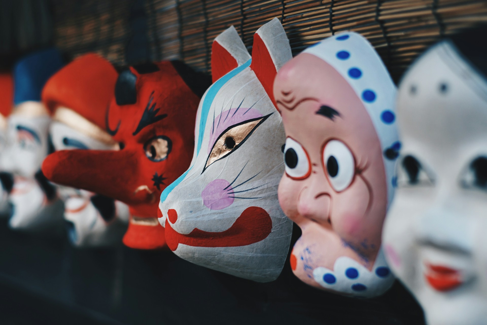 Japanese masks hang in a row